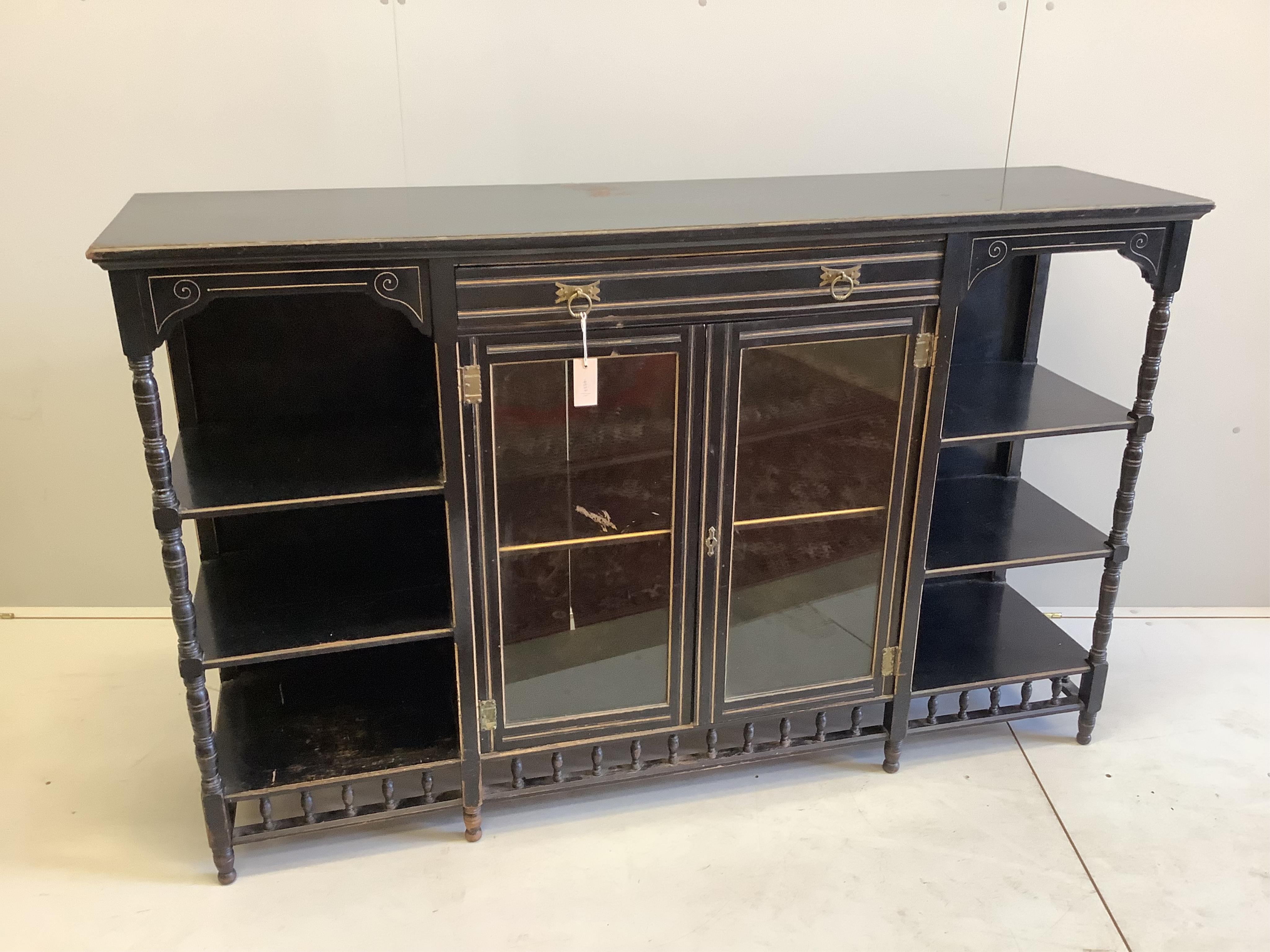 A late Victorian Aesthetic Movement ebonised side cabinet, width 167cm, depth 43cm, height 105cm. Condition - poor